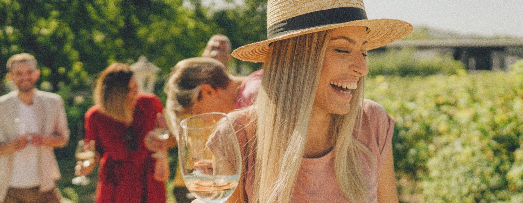 a person holding a glass of wine